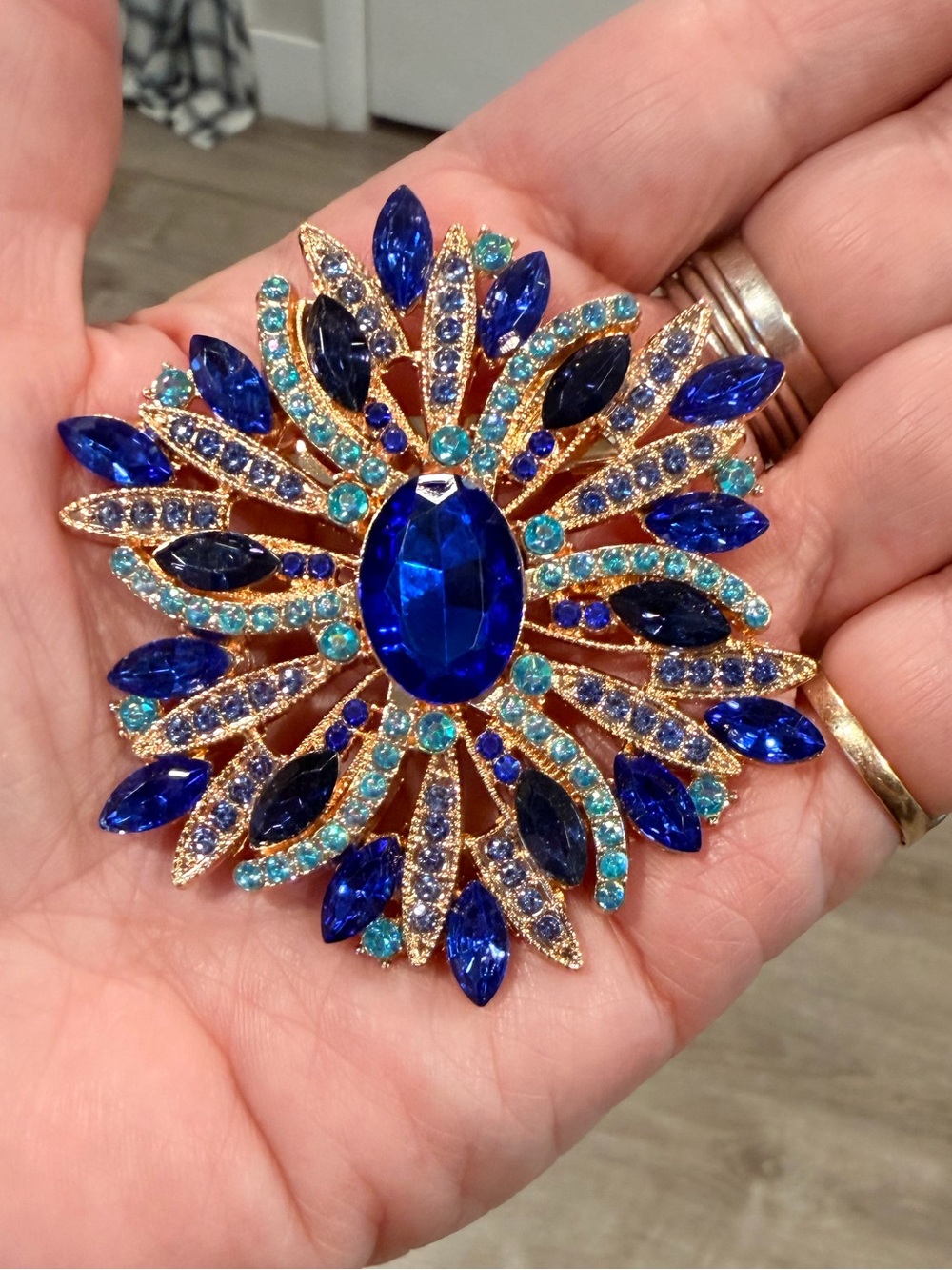 Gold-Tone Blue Crystal Floral Burst Brooch